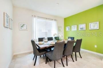 1512 Mumbai Way, Kissimmee, FL 34747 - dining room featuring baseboards