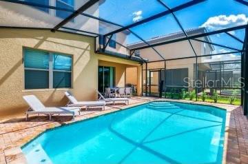 1512 Mumbai Way, Kissimmee, FL 34747 - outdoor pool with a patio area and a lanai