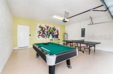 1512 Mumbai Way, Kissimmee, FL 34747 - recreation room with water heater, a garage, electric panel, and pool table