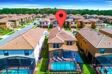 1512 Mumbai Way, Kissimmee, FL 34747 - aerial perspective of suburban area with a pool