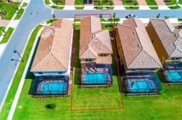 1512 Mumbai Way, Kissimmee, FL 34747 - aerial perspective of suburban area with a pool