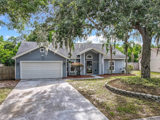 4274 Meeting Pl, Sanford, FL 32773 - ranch-style house featuring concrete driveway, a garage, and roof with shingles