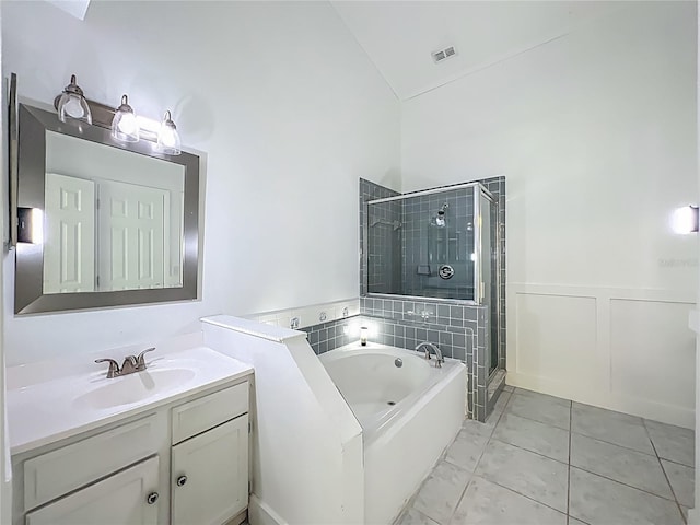 4274 Meeting Pl, Sanford, FL 32773 - bathroom featuring vanity, a garden tub, a stall shower, and high vaulted ceiling