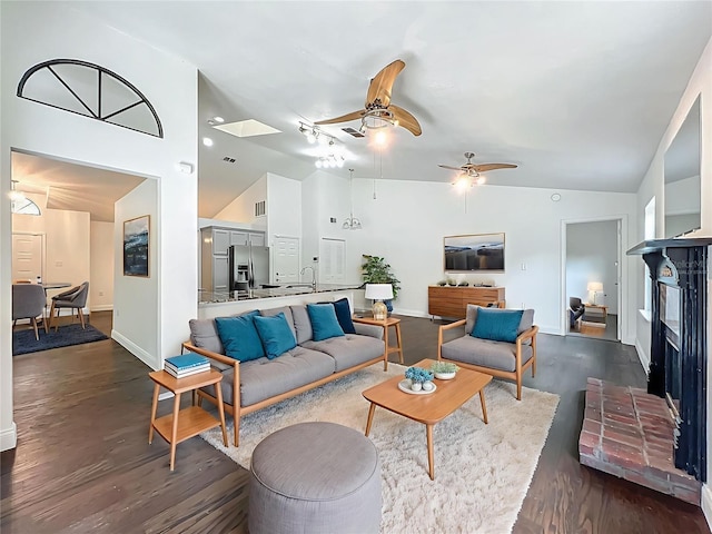 4274 Meeting Pl, Sanford, FL 32773 - living area featuring a ceiling fan, dark wood finished floors, high vaulted ceiling, and a fireplace