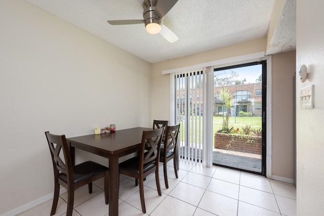 1300 Arlington Ln NE Unit 111, Palm Bay, FL 32905 - dining area featuring a textured ceiling, a ceiling fan, and light tile patterned flooring