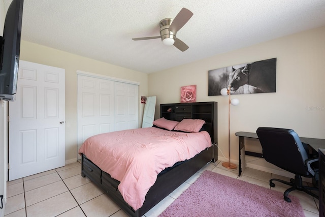 1300 Arlington Ln NE Unit 111, Palm Bay, FL 32905 - bedroom with a closet, light tile patterned flooring, an office area, a ceiling fan, and a textured ceiling