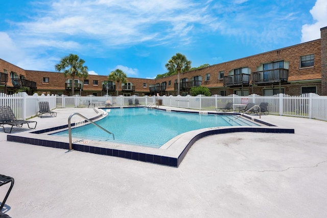 1300 Arlington Ln NE Unit 111, Palm Bay, FL 32905 - community pool featuring a patio area