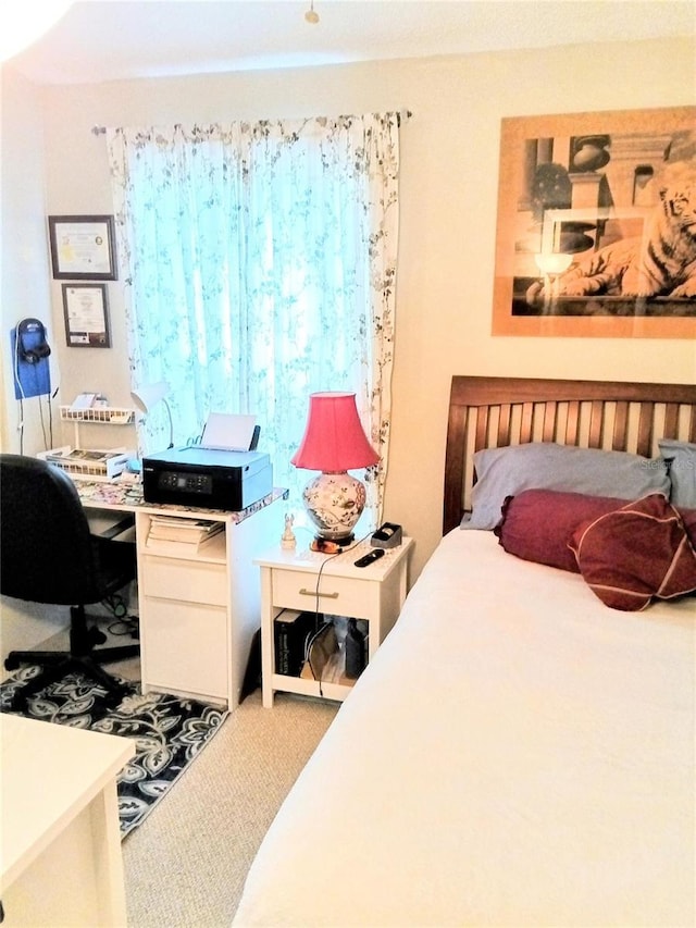 6640 121st Ave Unit 1, Largo, FL 33773 - carpeted bedroom with a desk