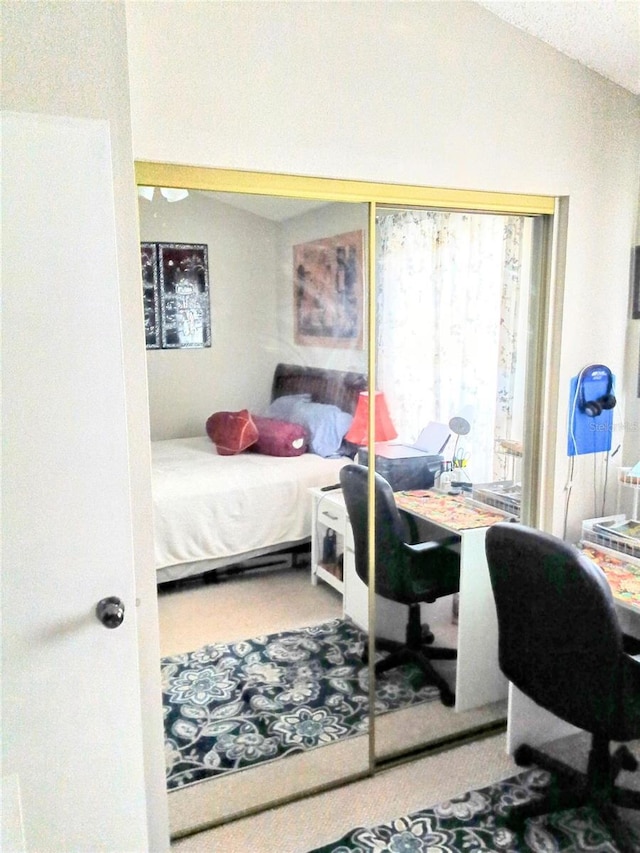 6640 121st Ave Unit 1, Largo, FL 33773 - bedroom featuring lofted ceiling, an office area, and carpet flooring