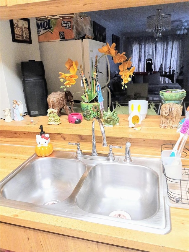 6640 121st Ave Unit 1, Largo, FL 33773 - kitchen view of a sink and freestanding refrigerator