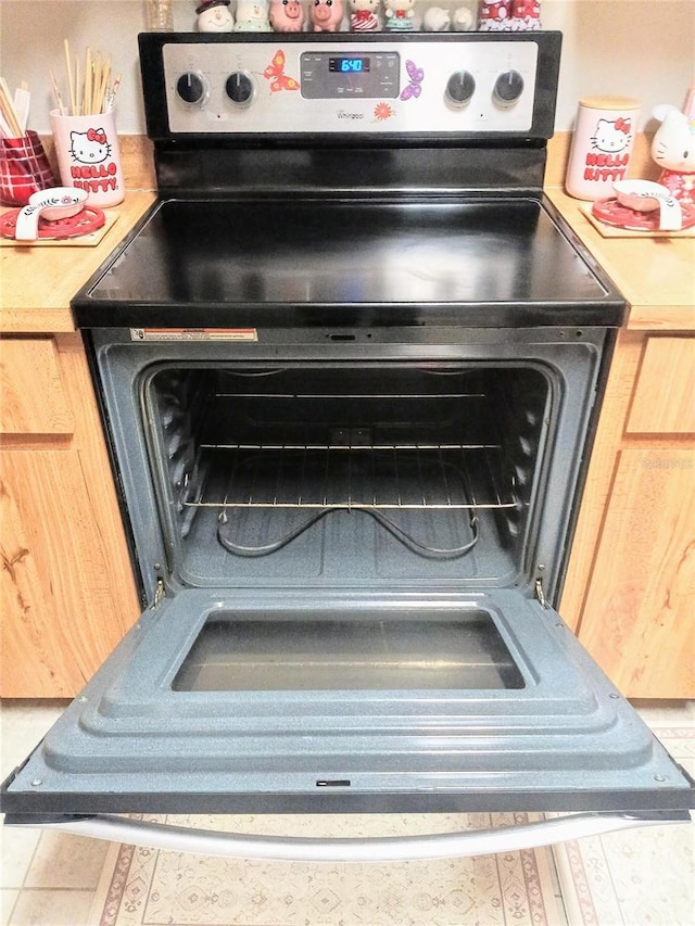 6640 121st Ave Unit 1, Largo, FL 33773 - kitchen view of range with electric cooktop and light countertops