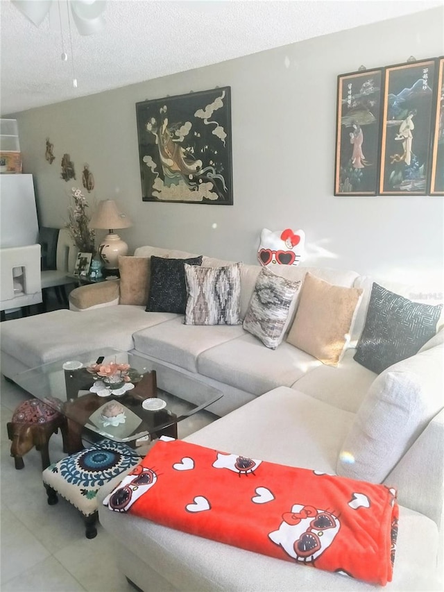 6640 121st Ave Unit 1, Largo, FL 33773 - living room featuring ceiling fan and a textured ceiling