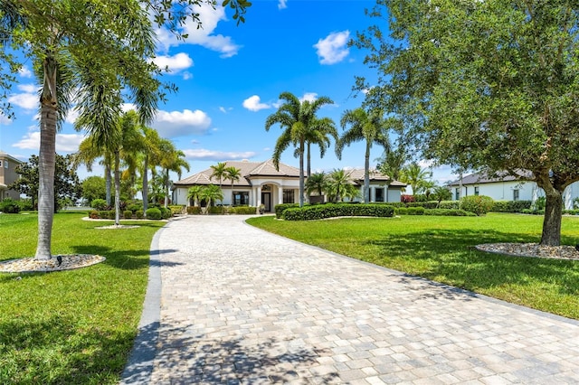 2873 Bellwind Cir, Rockledge, FL 32955 - view of front facade with curved driveway and a front yard