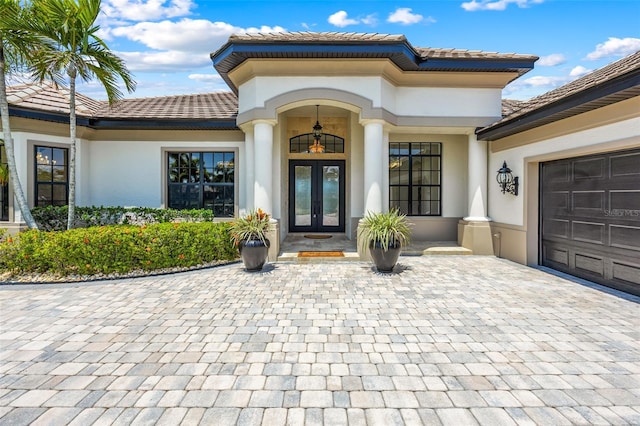 2873 Bellwind Cir, Rockledge, FL 32955 - property entrance featuring french doors, stucco siding, and a tile roof