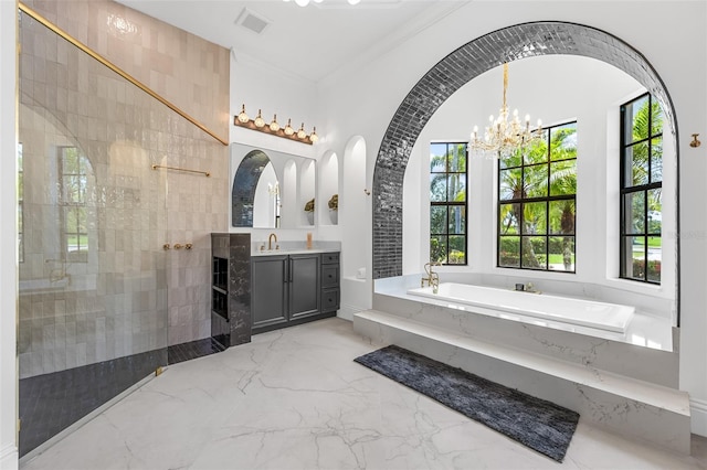 2873 Bellwind Cir, Rockledge, FL 32955 - full bathroom featuring vanity, a garden tub, marble tiled flooring, crown molding, and a chandelier