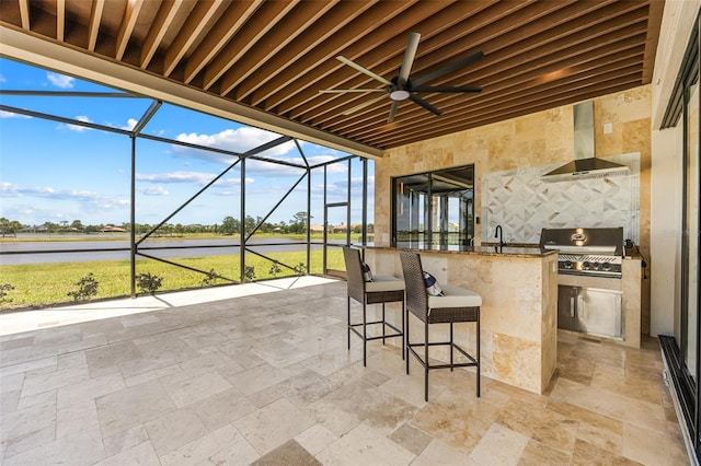2873 Bellwind Cir, Rockledge, FL 32955 - view of patio featuring exterior kitchen, a water view, glass enclosure, and ceiling fan