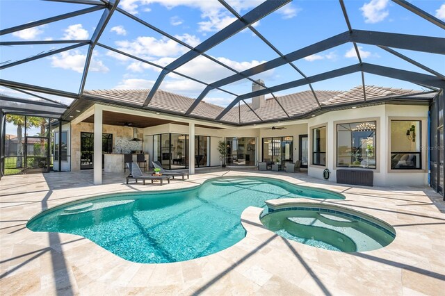 2873 Bellwind Cir, Rockledge, FL 32955 - view of swimming pool featuring ceiling fan, a patio area, a pool with connected hot tub, and a lanai