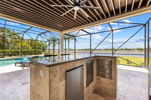 2873 Bellwind Cir, Rockledge, FL 32955 - view of patio / terrace featuring area for grilling, a water view, a lanai, and an outdoor pool