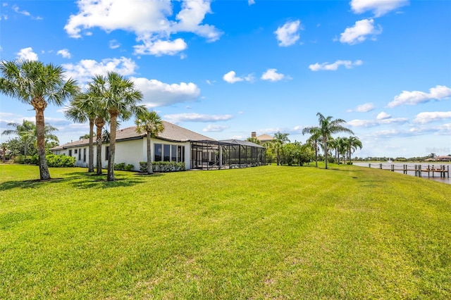 2873 Bellwind Cir, Rockledge, FL 32955 - view of green lawn with a water view and glass enclosure