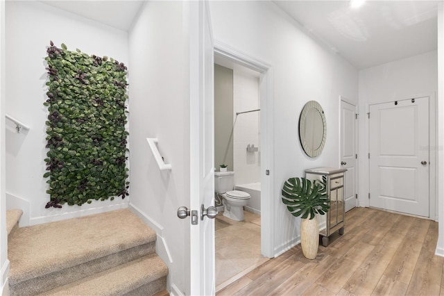 3279 Canna Lily Pl, Clermont, FL 34711 - stairs featuring wood finished floors and baseboards