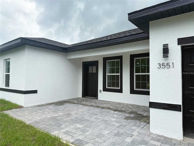 3551 W Fleece Dr, Dunnellon, FL 34433 - view of exterior entry featuring stucco siding