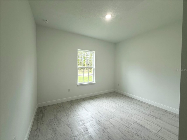 3551 W Fleece Dr, Dunnellon, FL 34433 - spare room with baseboards and a smoke detector