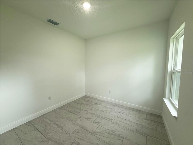 3551 W Fleece Dr, Dunnellon, FL 34433 - unfurnished room with light marble finish flooring and baseboards
