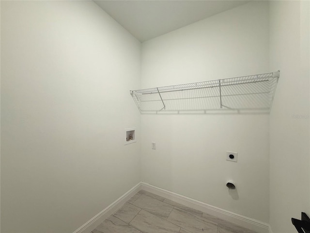 3551 W Fleece Dr, Dunnellon, FL 34433 - washroom with washer hookup, electric dryer hookup, and light marble finish flooring