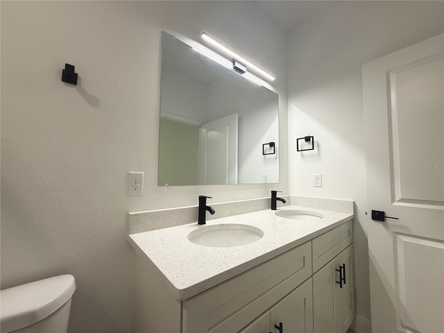 3551 W Fleece Dr, Dunnellon, FL 34433 - bathroom with double vanity and toilet
