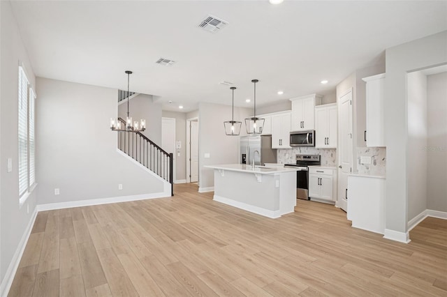 16526 Silver Brook Way, Winter Garden, FL 34787 - kitchen featuring stainless steel appliances, backsplash, light wood-type flooring, light countertops, and recessed lighting