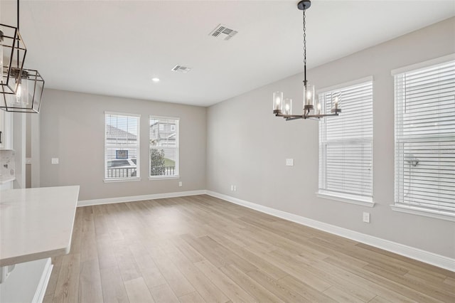 16526 Silver Brook Way, Winter Garden, FL 34787 - unfurnished dining area featuring a chandelier, light wood-type flooring, and recessed lighting