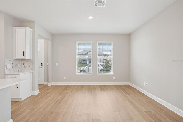 16526 Silver Brook Way, Winter Garden, FL 34787 - unfurnished living room featuring light wood finished floors and recessed lighting