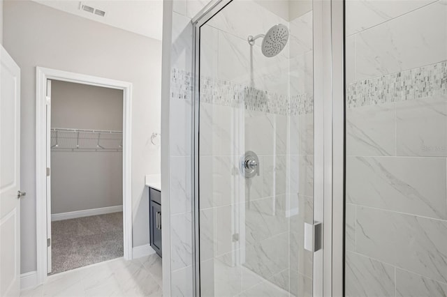 16526 Silver Brook Way, Winter Garden, FL 34787 - full bath featuring a shower stall, a walk in closet, vanity, and marble finish floors