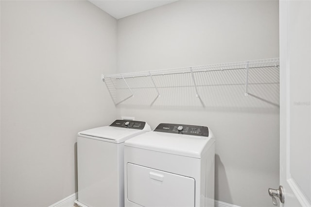 16526 Silver Brook Way, Winter Garden, FL 34787 - washroom with washer and clothes dryer and baseboards