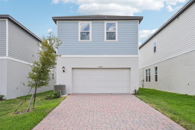 16526 Silver Brook Way, Winter Garden, FL 34787 - view of front of house featuring decorative driveway, a garage, a front yard, and stucco siding