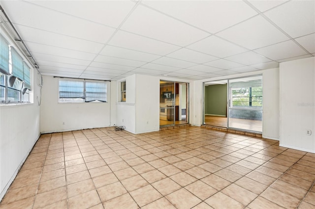 2020 Cocos Ct, Winter Park, FL 32792 - unfurnished room featuring a paneled ceiling and light tile patterned floors