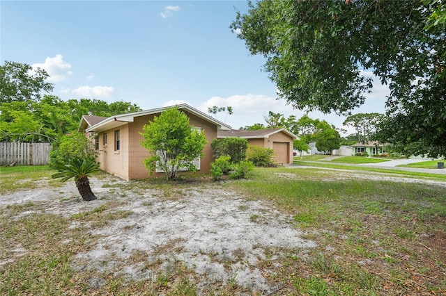 2020 Cocos Ct, Winter Park, FL 32792 - view of front of home with a garage and concrete block siding