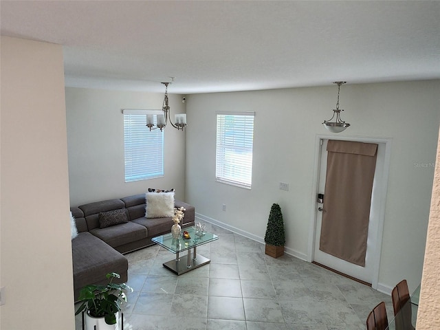11802 Pulitzer Pl, Orlando, FL 32832 - living area with a chandelier and light tile patterned floors