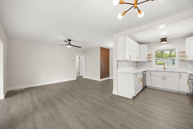 4714 Abaca St, Orlando, FL 32808 - kitchen featuring open shelves, dishwasher, tasteful backsplash, open floor plan, and light countertops