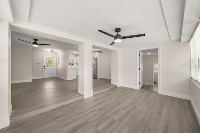 4714 Abaca St, Orlando, FL 32808 - unfurnished living room with ceiling fan and light wood-type flooring