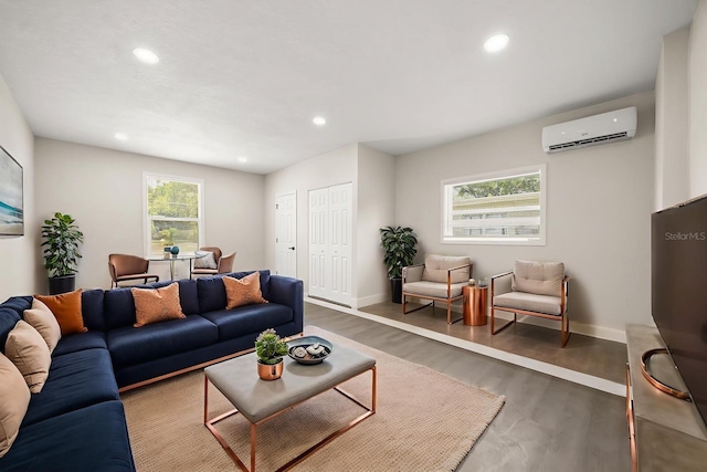 4714 Abaca St, Orlando, FL 32808 - living area with a wall unit AC, healthy amount of natural light, wood finished floors, and recessed lighting