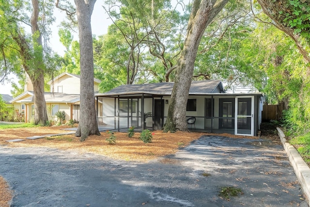 709 1st Ave NE, Largo, FL 33770 - single story home featuring a sunroom