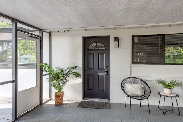 709 1st Ave NE, Largo, FL 33770 - view of exterior entry with stucco siding