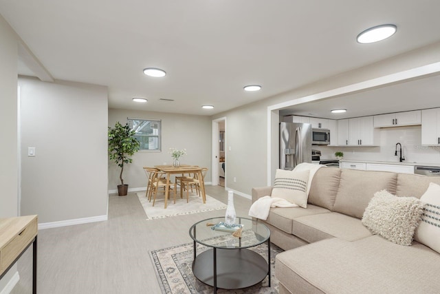 709 1st Ave NE, Largo, FL 33770 - living area with baseboards and recessed lighting