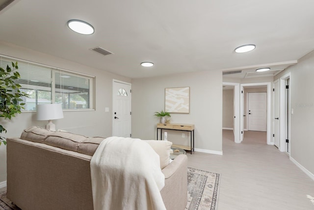 709 1st Ave NE, Largo, FL 33770 - living room featuring light wood-style floors and baseboards
