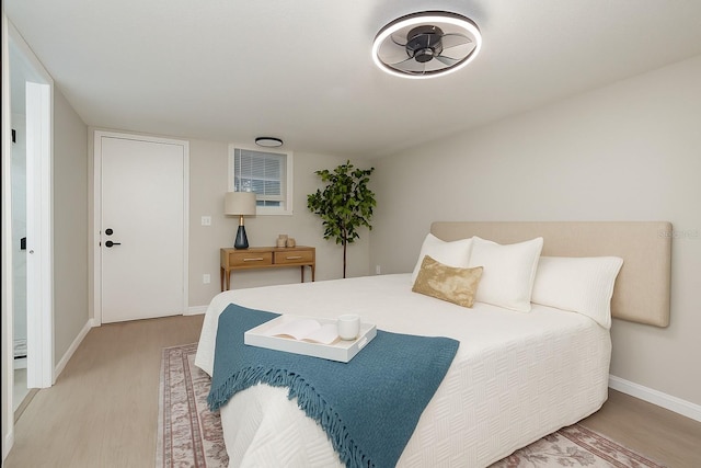709 1st Ave NE, Largo, FL 33770 - bedroom featuring light wood-style flooring and baseboards
