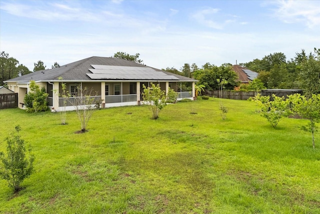 18920 Overton St, Orlando, FL 32833 - rear view of property featuring a sunroom and roof mounted solar panels