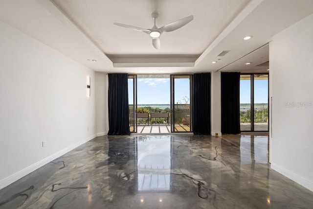 111 E Monument Ave Unit 801, Kissimmee, FL 34741 - empty room with a tray ceiling, a ceiling fan, and recessed lighting