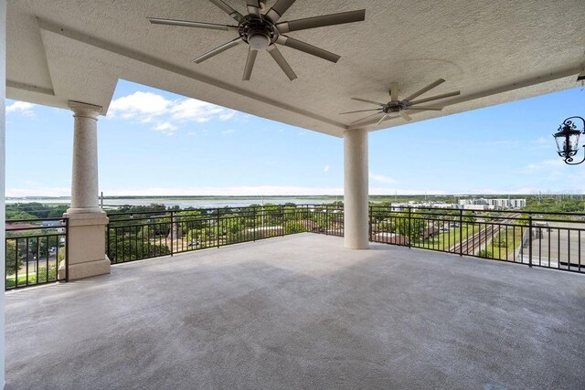 111 E Monument Ave Unit 801, Kissimmee, FL 34741 - view of patio / terrace with ceiling fan and a water view