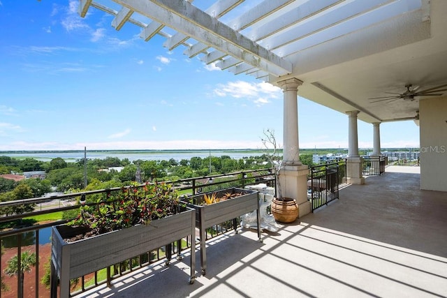 111 E Monument Ave Unit 801, Kissimmee, FL 34741 - view of patio / terrace with a water view and ceiling fan